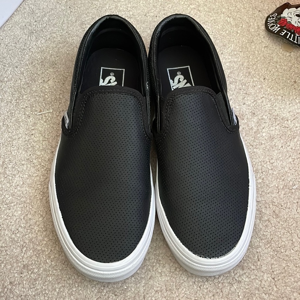 Vans black perf leather slip ons